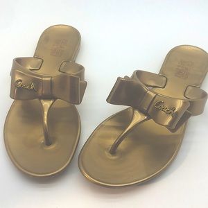 COACH Gold Bow Flip Flop Sandals size 6